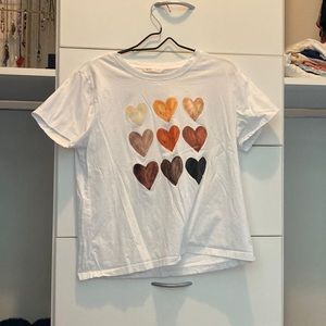 White short sleeve shirt with colored hearts on front